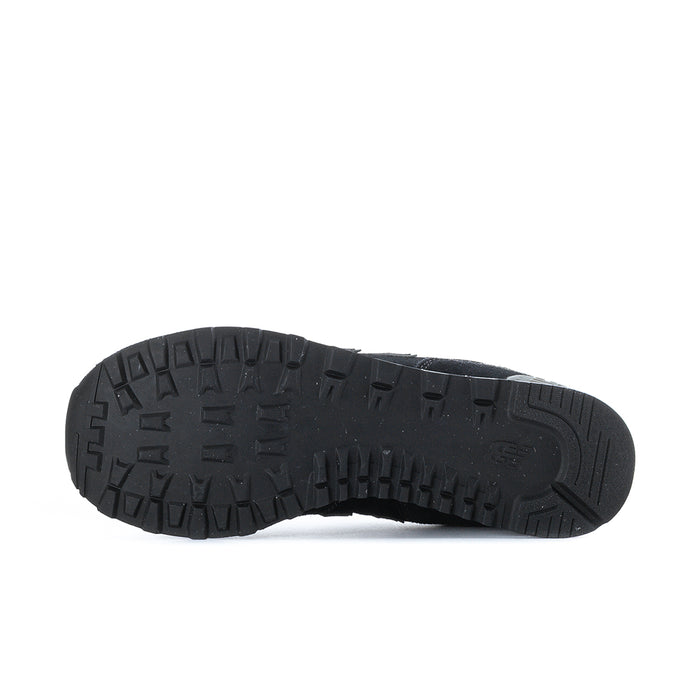 Men's New Balance 574 extra-wide sneakers outsole with deep tread, dark rubber base.