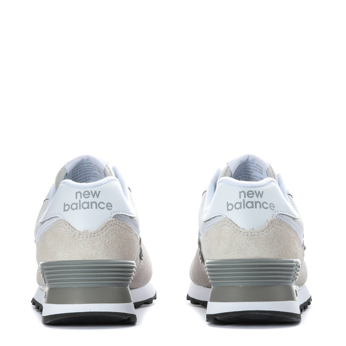 Women's New Balance 574 wide sneakers, 'new balance' heel branding, rubber heel tab.