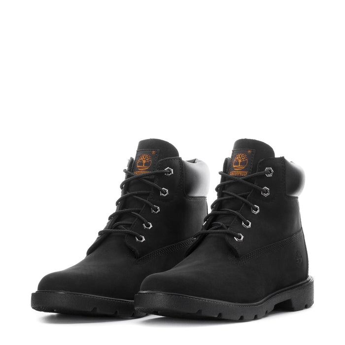 Youth black lace-up boots with orange logo patch and chunky sole