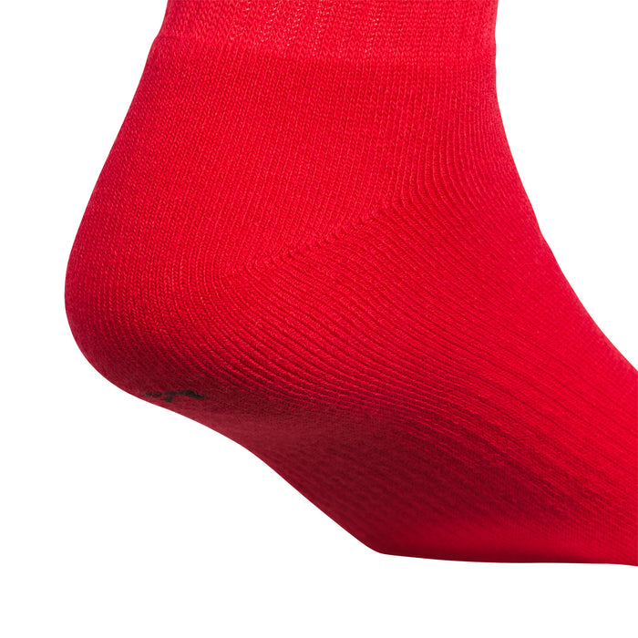 Red crew sock toe showing fine knit texture and ribbed stretch