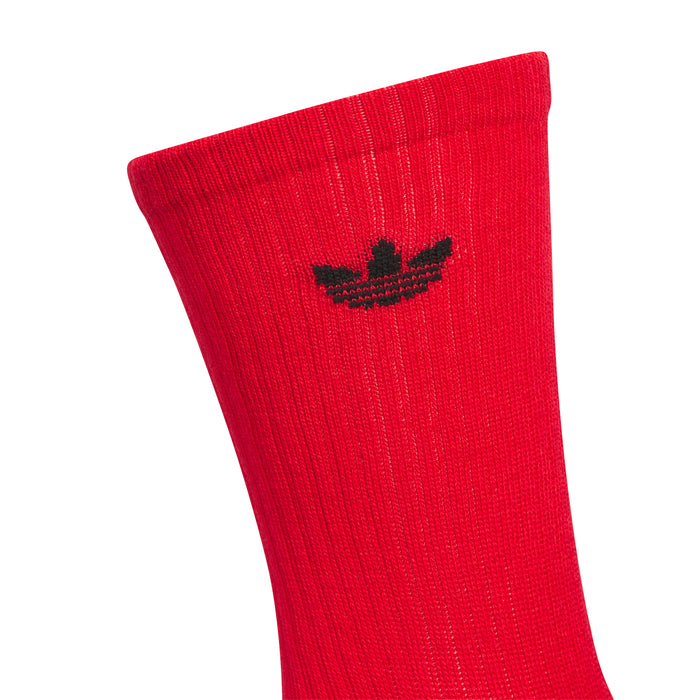 Red crew sock with black adidas trefoil logo on the side
