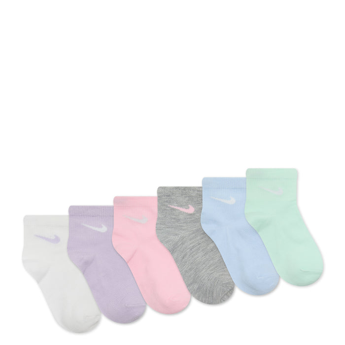 6-pack x-small quarter socks laid out, pastel tones with metallic swoosh logos