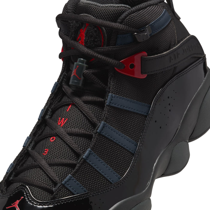 Close-up of men's high-top shoe tongue and laces in black with blue and red details