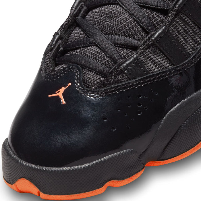 Youth black high-top shoe with textured panels, perforations, and Jumpman logo detail