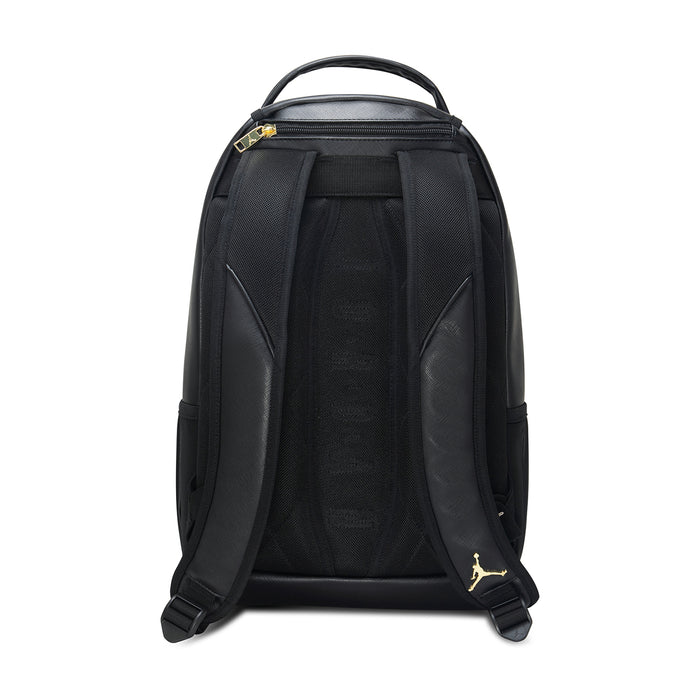 Black backpack back view with padded shoulder straps and gold Jumpman accents