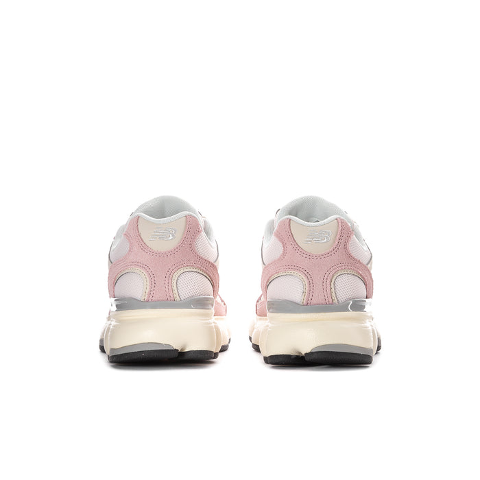 Women’s pink and white New Balance sneakers, heel view with cushioned midsole