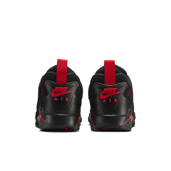 Men's black sneakers with red strap at heel and NIKE AIR text on the back