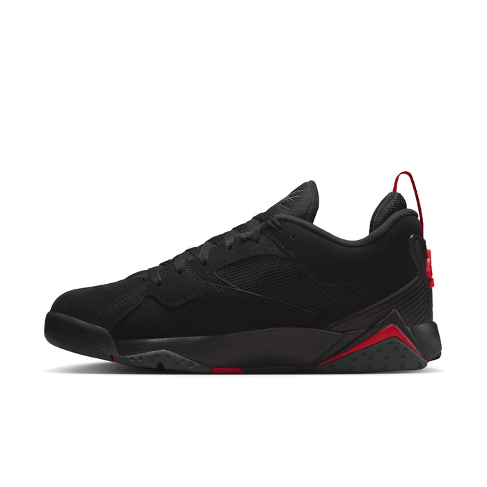 Men's black low-top sneaker with red-lined collar, lace-up front, and rubber sole