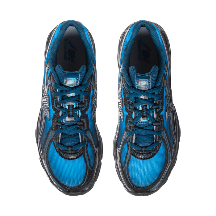 Pair of men's New Balance sneakers viewed from the top, blue mesh with lace-up closure.