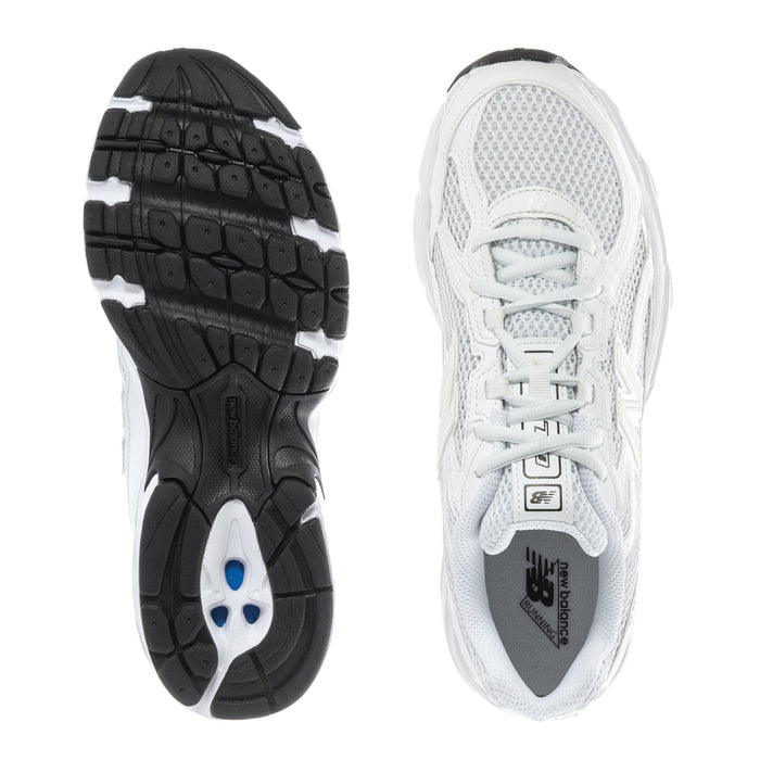 Women's white lace-up sneakers with tread outsole and mesh upper view