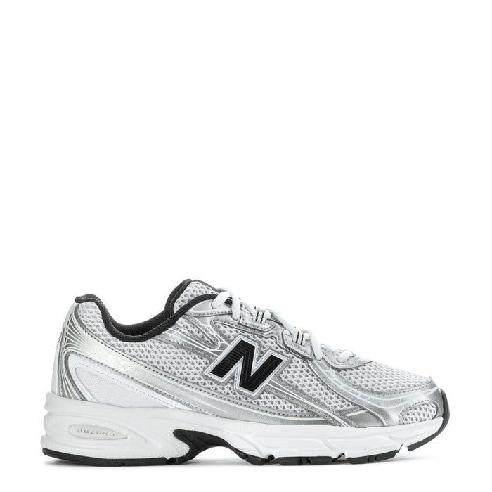 Silver youth running sneaker with black trim, mesh upper, New Balance 'N' logo