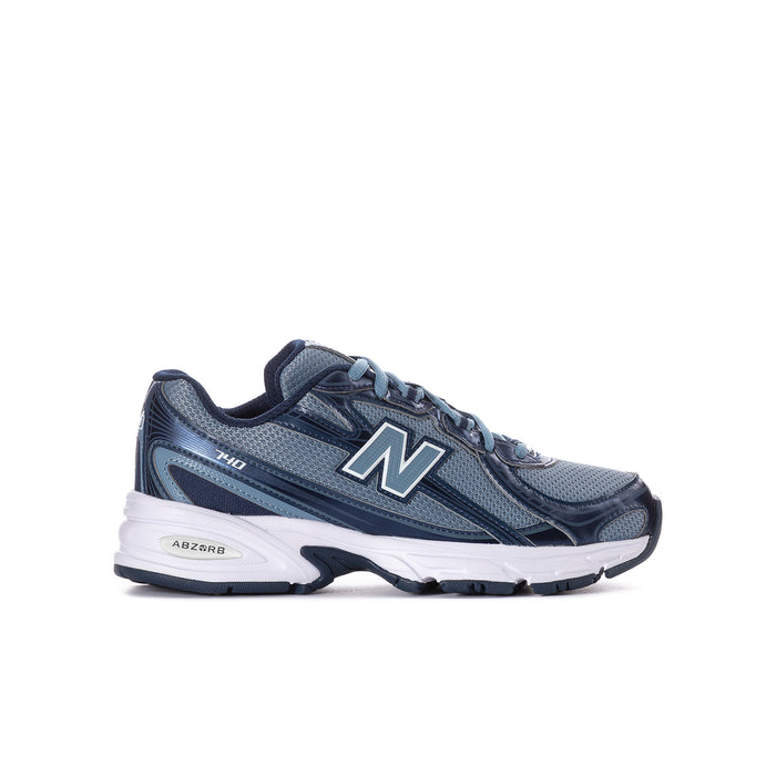 Youth running shoe in shadow blue and navy with New Balance N logo
