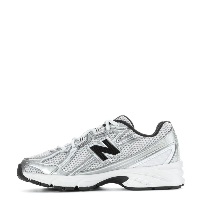 Silver youth running sneaker, side view, black heel tab, white laces