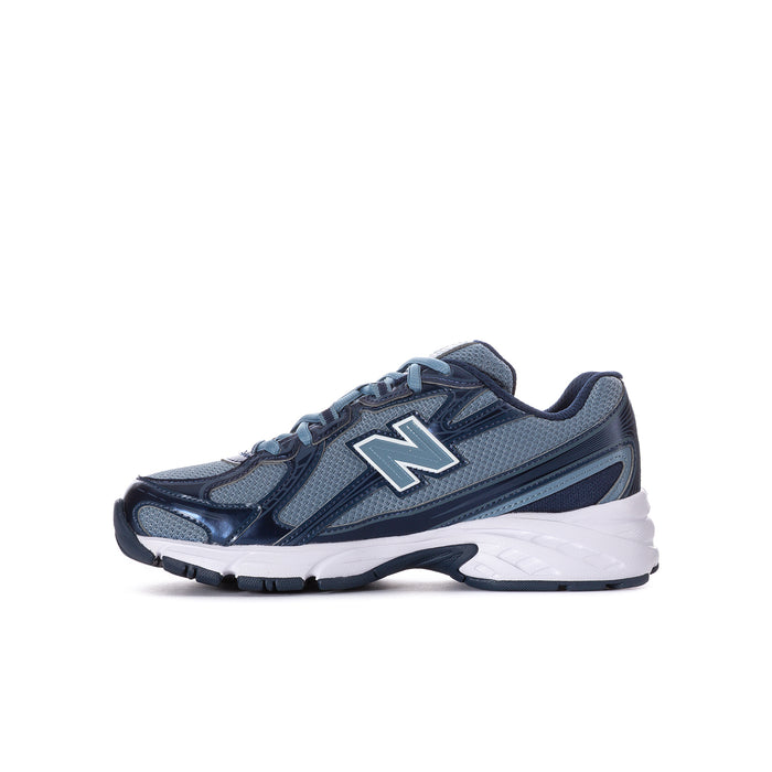 Youth running shoe side profile, shadow blue upper with white and navy accents