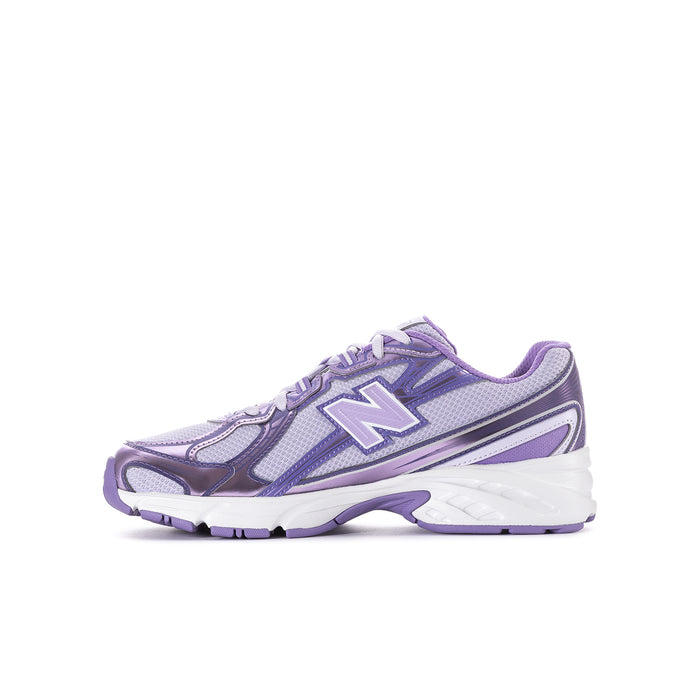 Lilac and violet youth sneakers, front-side angle showing New Balance N and textured outsole