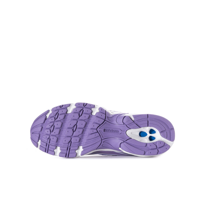 Lilac and violet youth sneaker outsole with tread pattern and blue heel accent