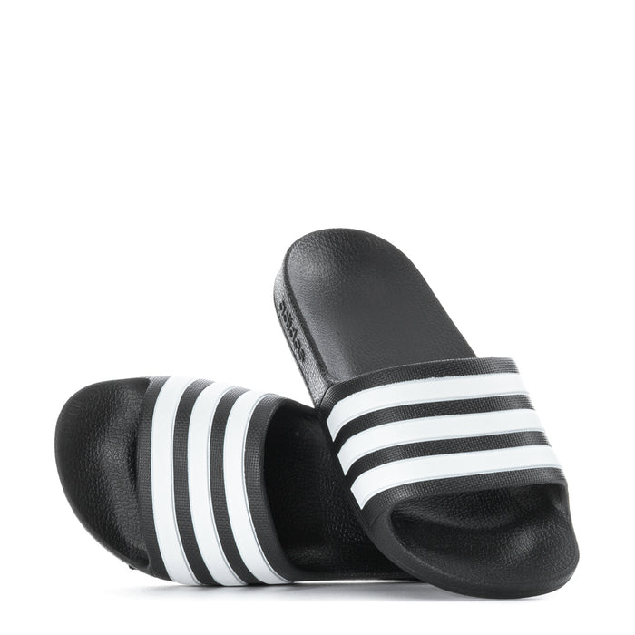 Kids black slide sandals pair with white triple stripes and open toe