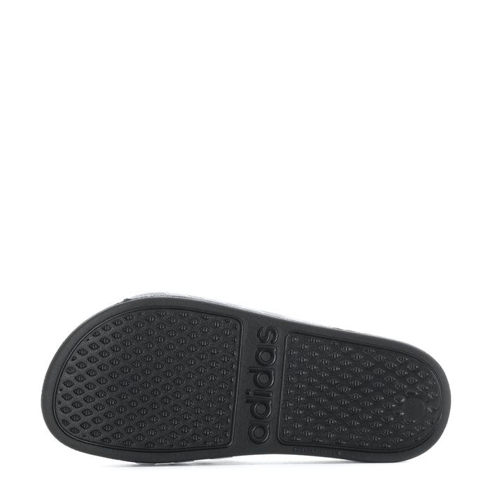 Kids black slide sandal outsole with textured grip pattern