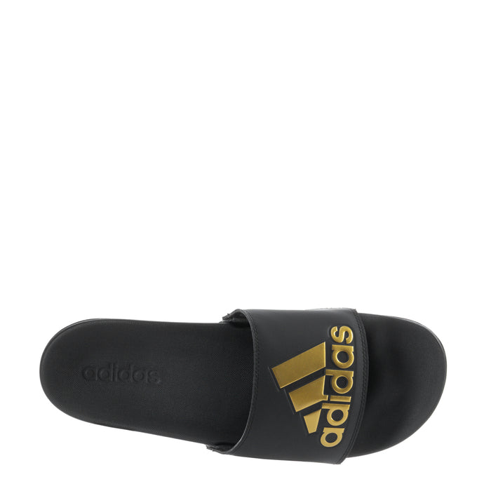 Men's black slide sandals, sole-side view with gold adidas logo on strap