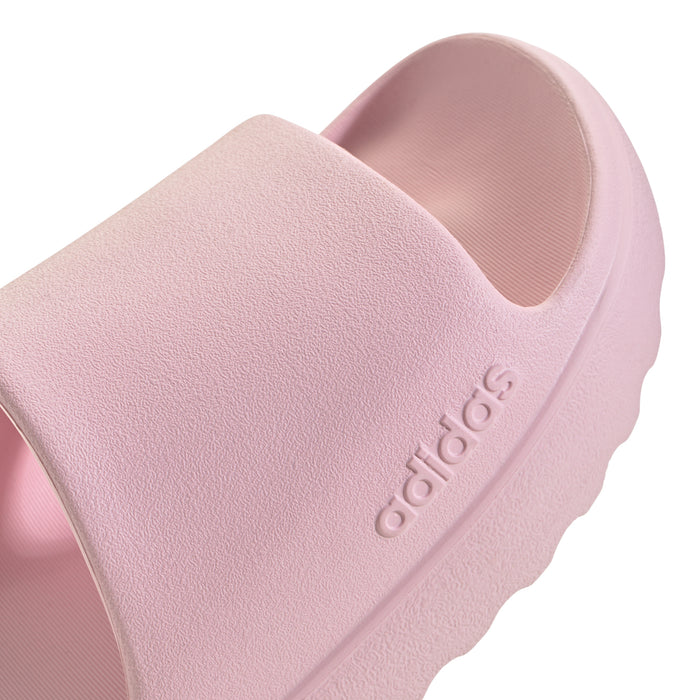 Close-up of clear pink slide sandal strap with adidas logo on the side