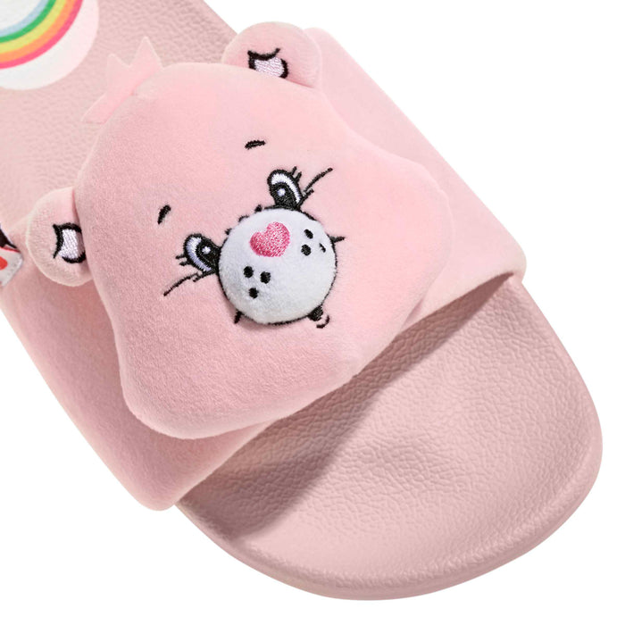 Close-up of pink plush bear patch on slide strap