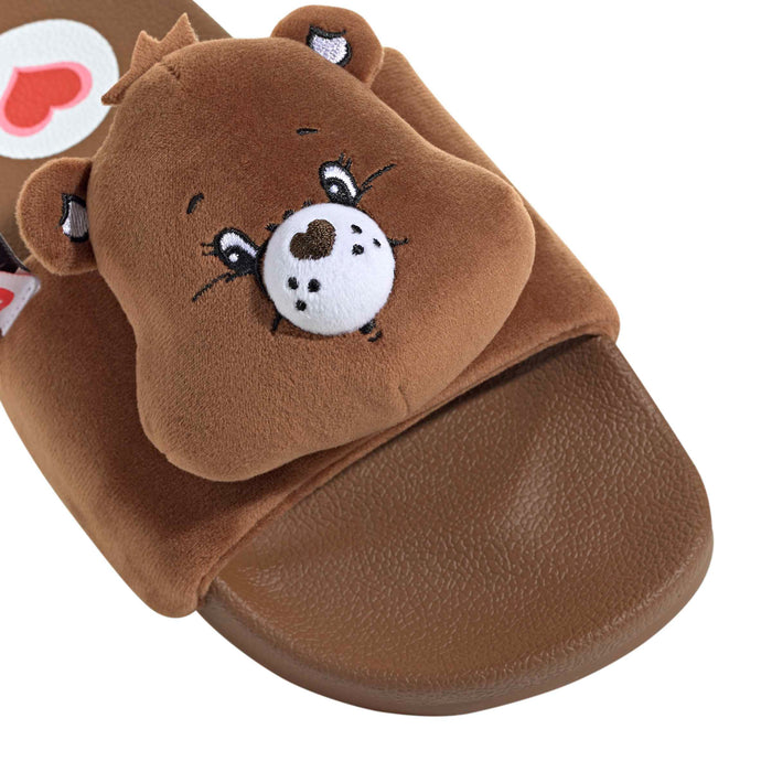 Women’s brown slide sandals with close-up plush bear face applique on strap