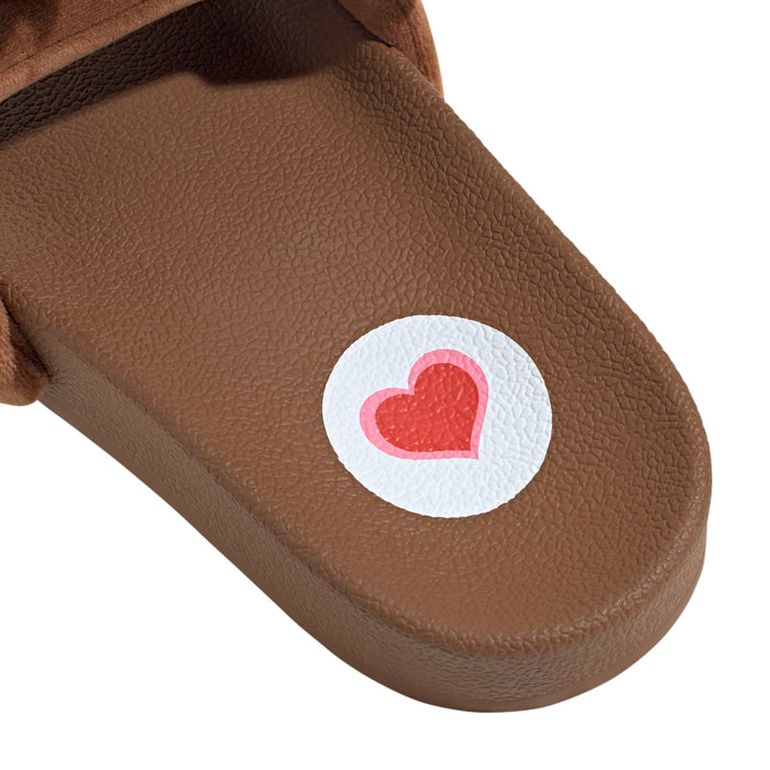 Women’s brown slide sandals with heart logo patch on the foot strap