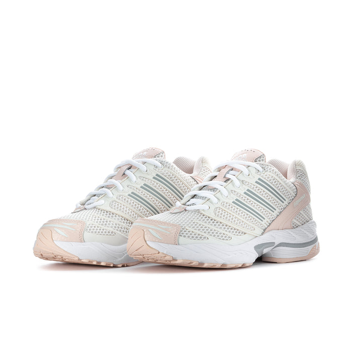 Women’s running shoes, side view; white knit upper with mint stripes and peach accents