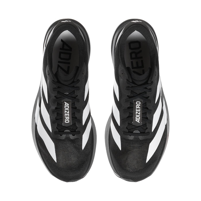 Pair of black lace-up sneakers with white side stripes and heel tab branding detail
