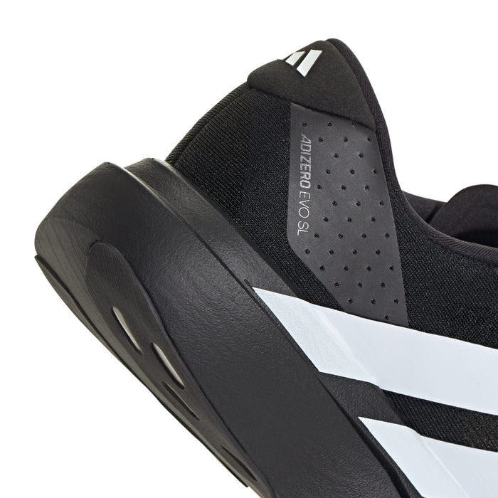 Close-up of black heel and inner collar with perforations and white stripe detail