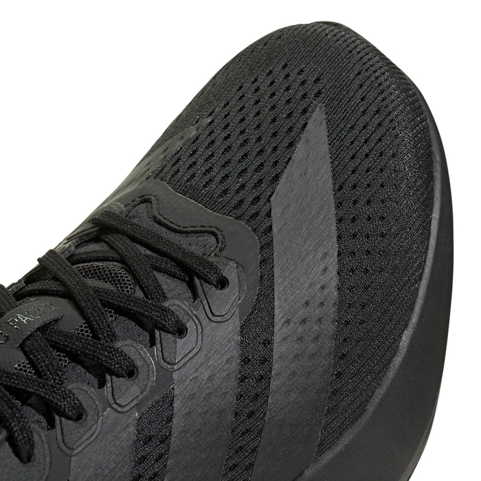 Men's black running shoe close-up of mesh upper and lace panel
