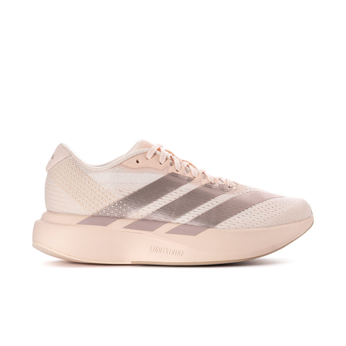Women’s running shoes in light pink with metallic gray stripes and lace-up closure.