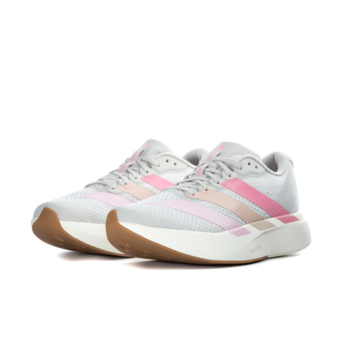 Women's running shoe, grey upper with pink accents and beige stripe detail, white sole