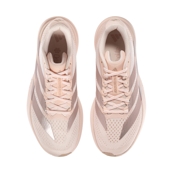 Pair of women’s light pink running shoes with lace-up fronts and breathable mesh panels.
