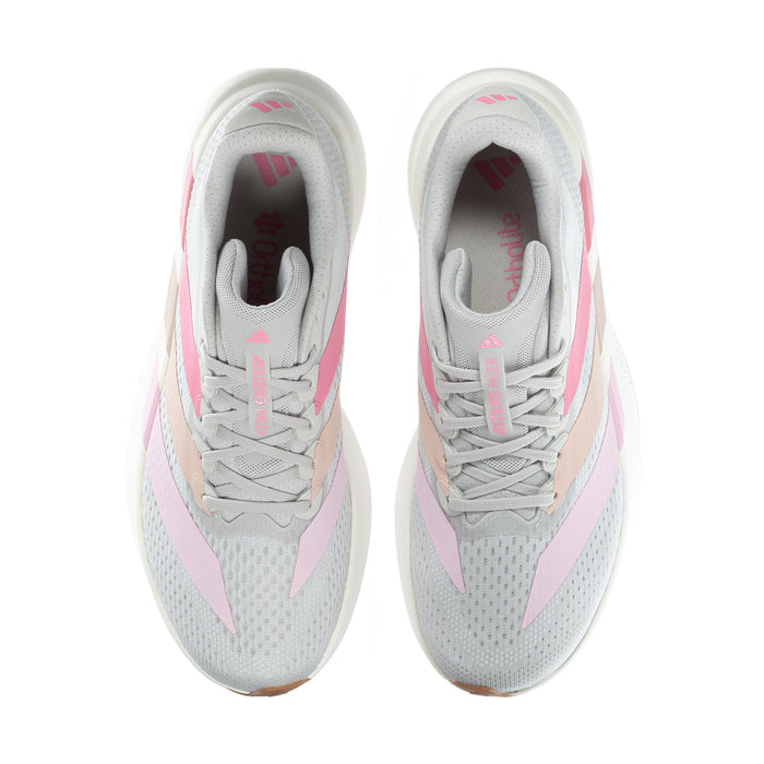 Pair of women's grey running shoes with pink panels and lace-up front, mesh texture