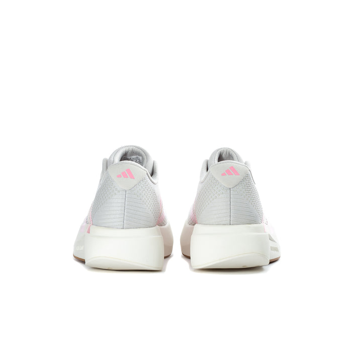 Women's grey running shoes with pink heel lining and white back tab, lace-up design
