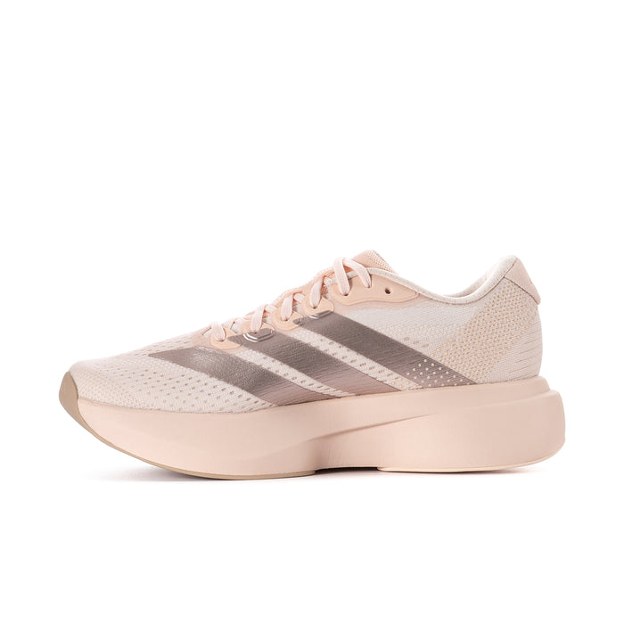 Women’s running shoes in light pink with metallic gray stripes and low-profile sole.
