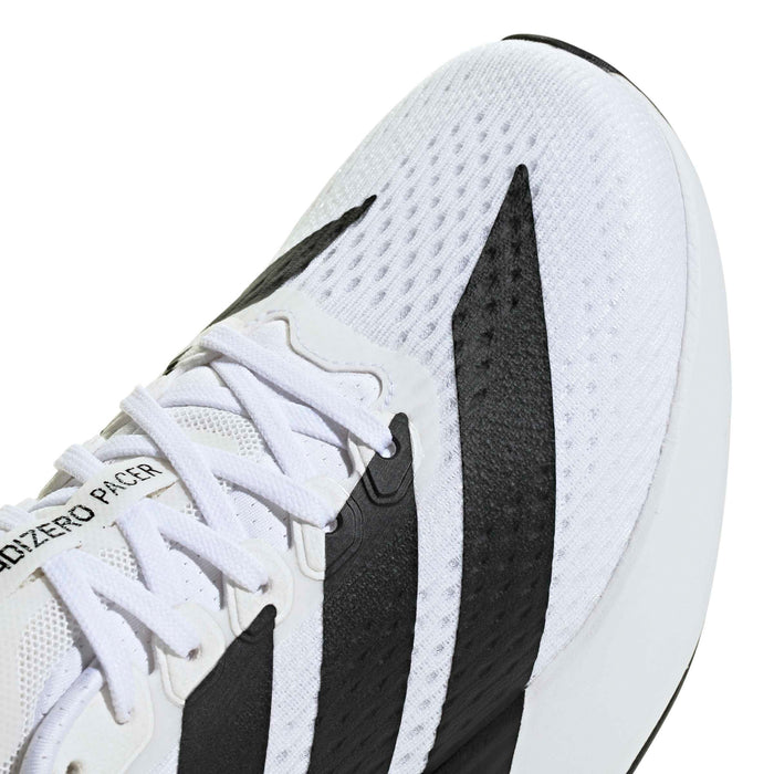 Women’s running shoe side view, white knit upper with black stripe and laces