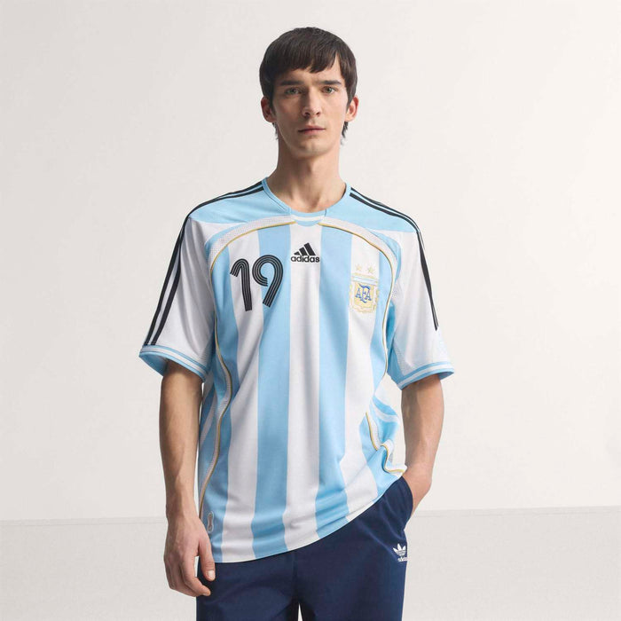 Men's light blue and white striped football jersey with adidas logo and AFA crest