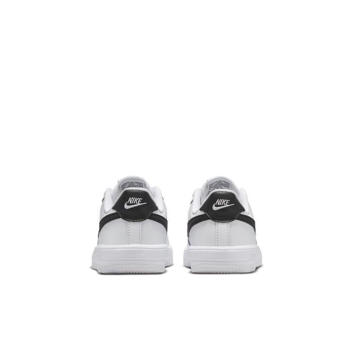 Kids' white sneakers with black heel tab and cushioned back, rear view