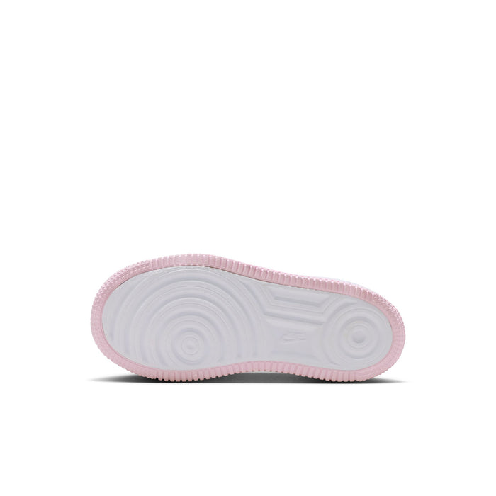 Kids Nike sneaker outsole, textured rubber tread with pink edge trim