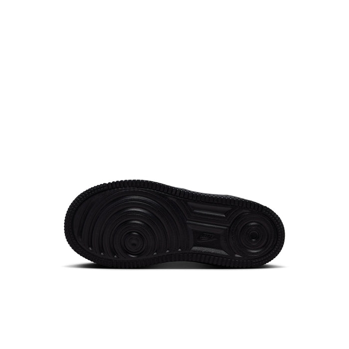 Black rubber outsole for kids Nike Air Force 1 sneakers with circular traction pattern