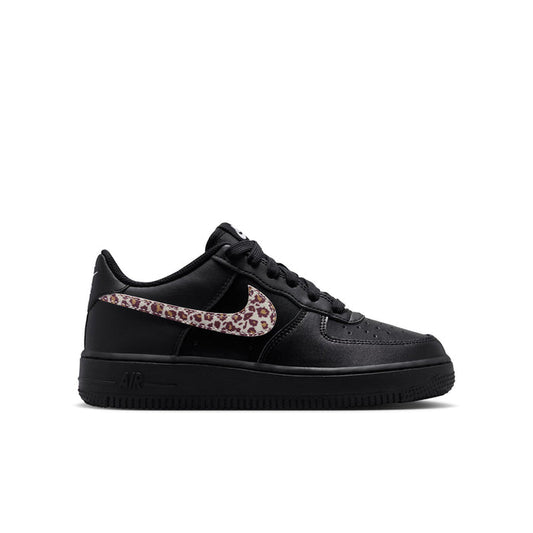 Youth black low-top sneaker with leopard-print Nike Swoosh and lace-up closure