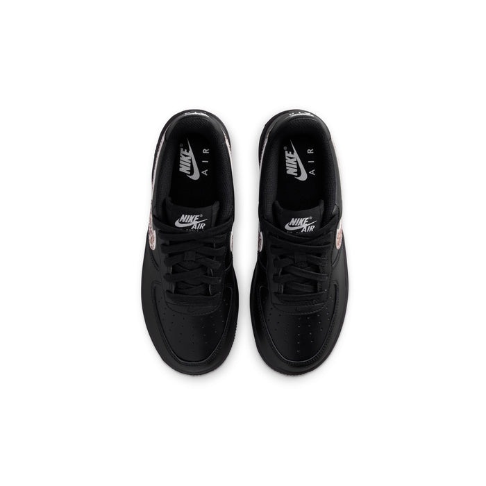 Black youth sneaker with Nike Air logo on tongue and lace-up design