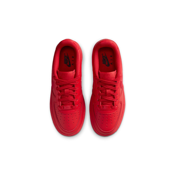 Red youth sneakers with open laces and padded tongue interior