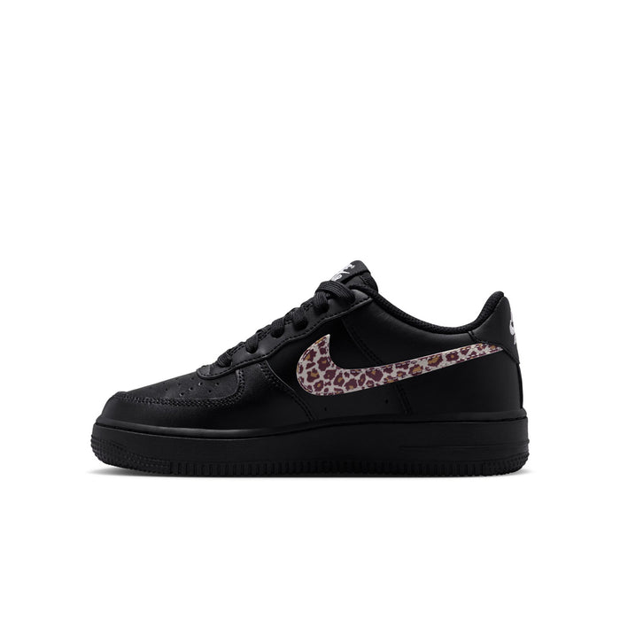 Youth black low-top sneaker with leopard-print Swoosh and perforated toe