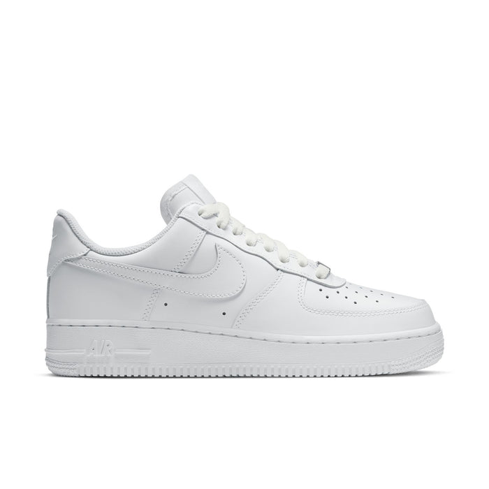 Women's white low-top sneakers, Nike Swoosh, lace-up leather