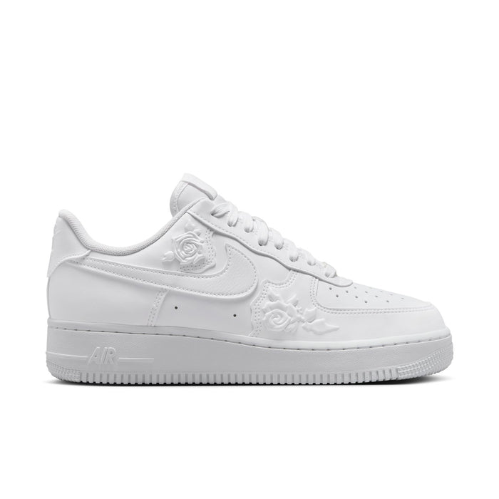 Women's Nike white low-top sneaker with subtle floral emboss detail