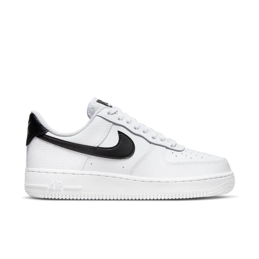 Women’s white low-top sneaker with black Swoosh and perforated toe box
