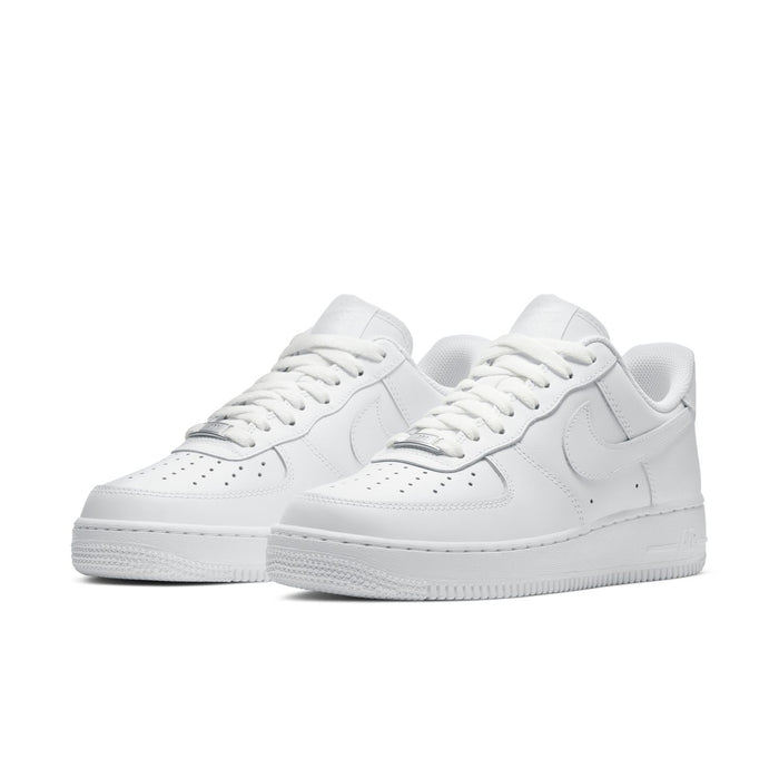 Women's white low-top sneakers, front view with Nike Swoosh, lace-up